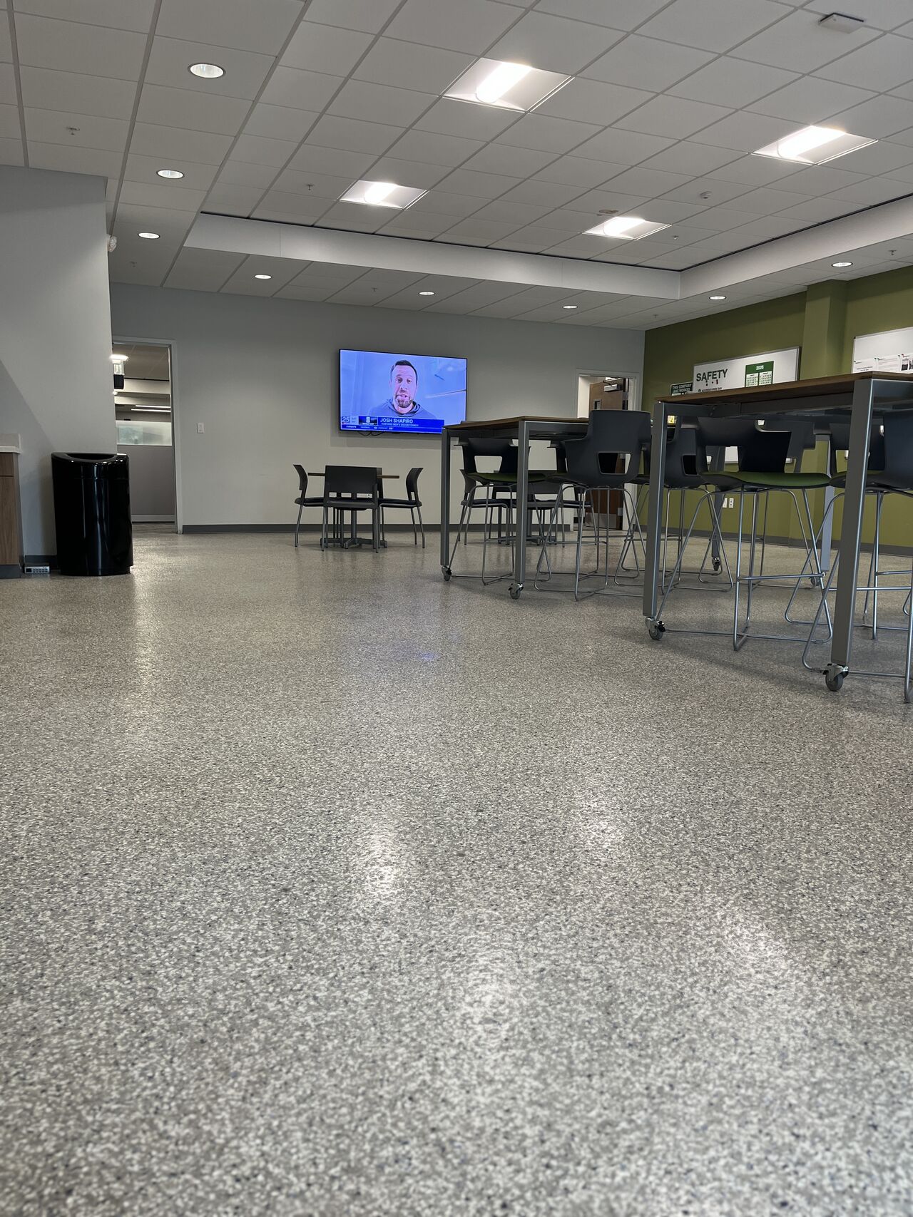 Wide view of epoxy flake flooring in a commercial lounge