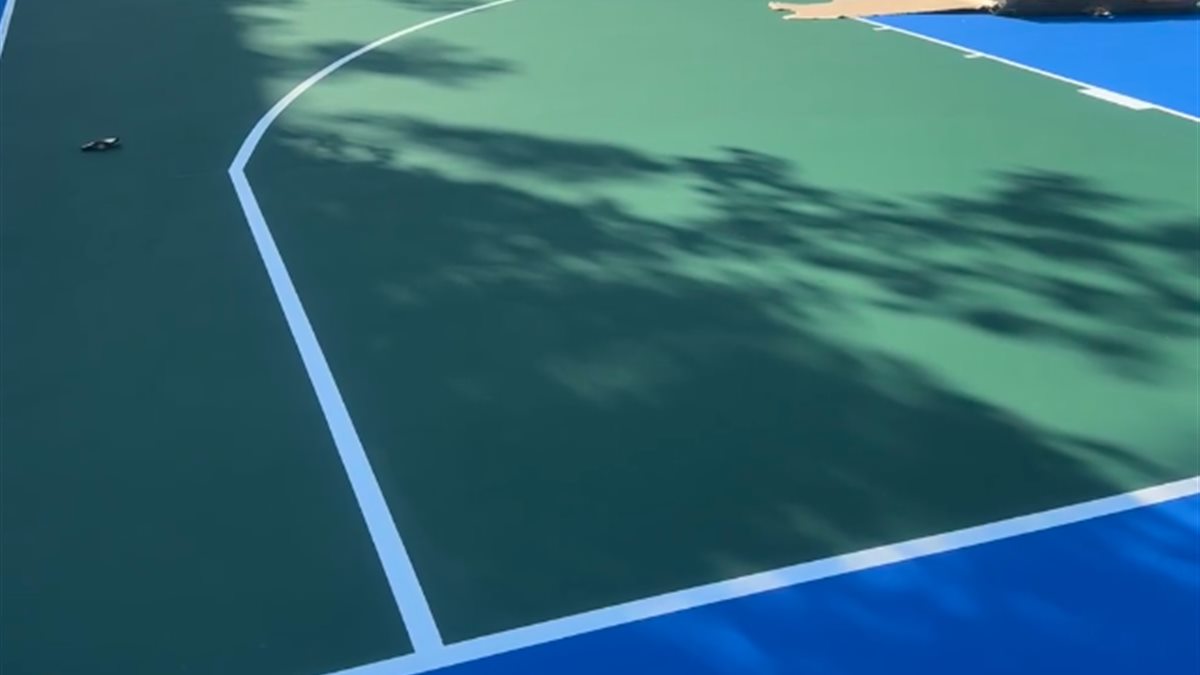 Wide view of completed acrylic community sports court
