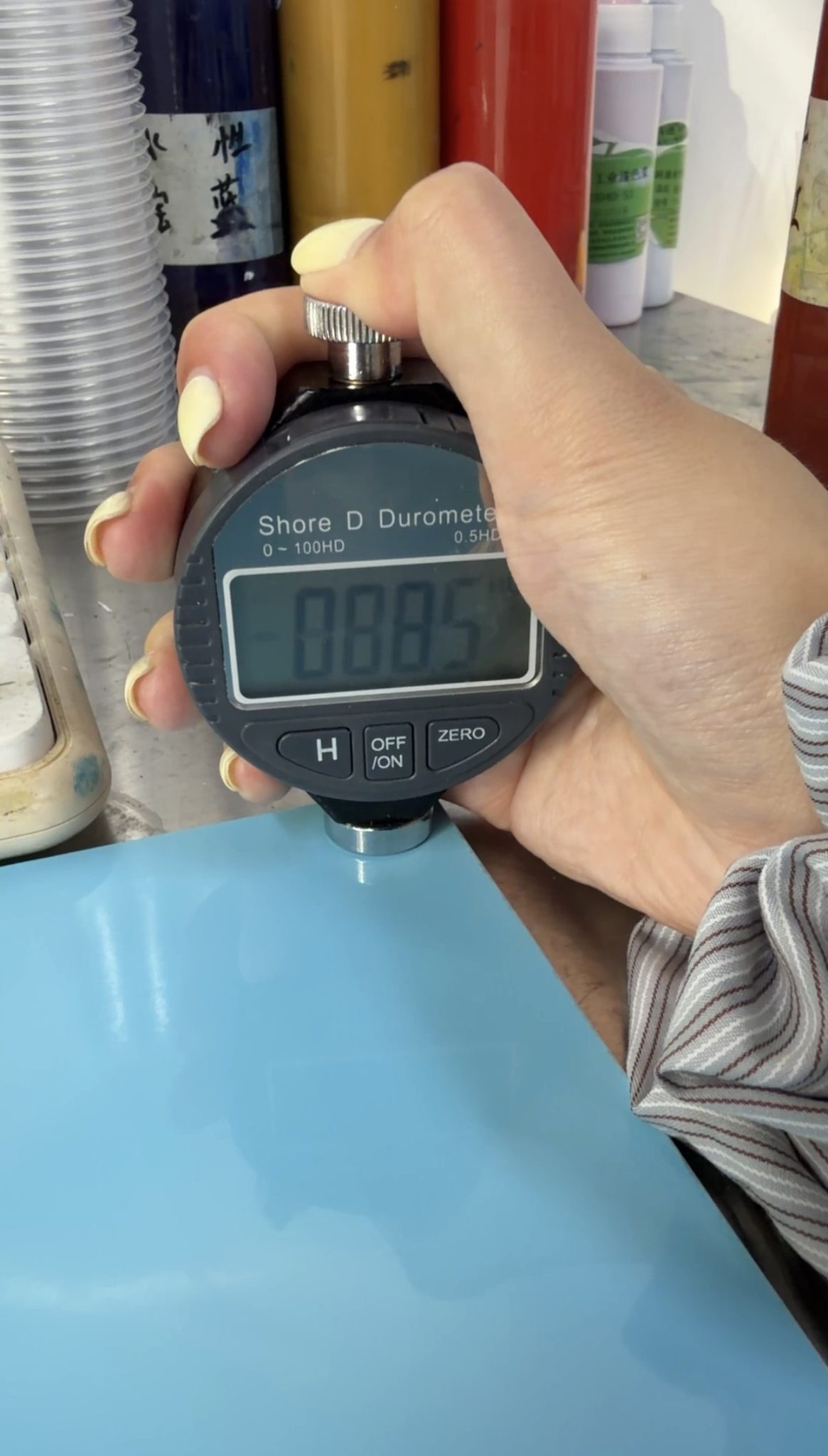 Hardness testing of a cured blue coating sample