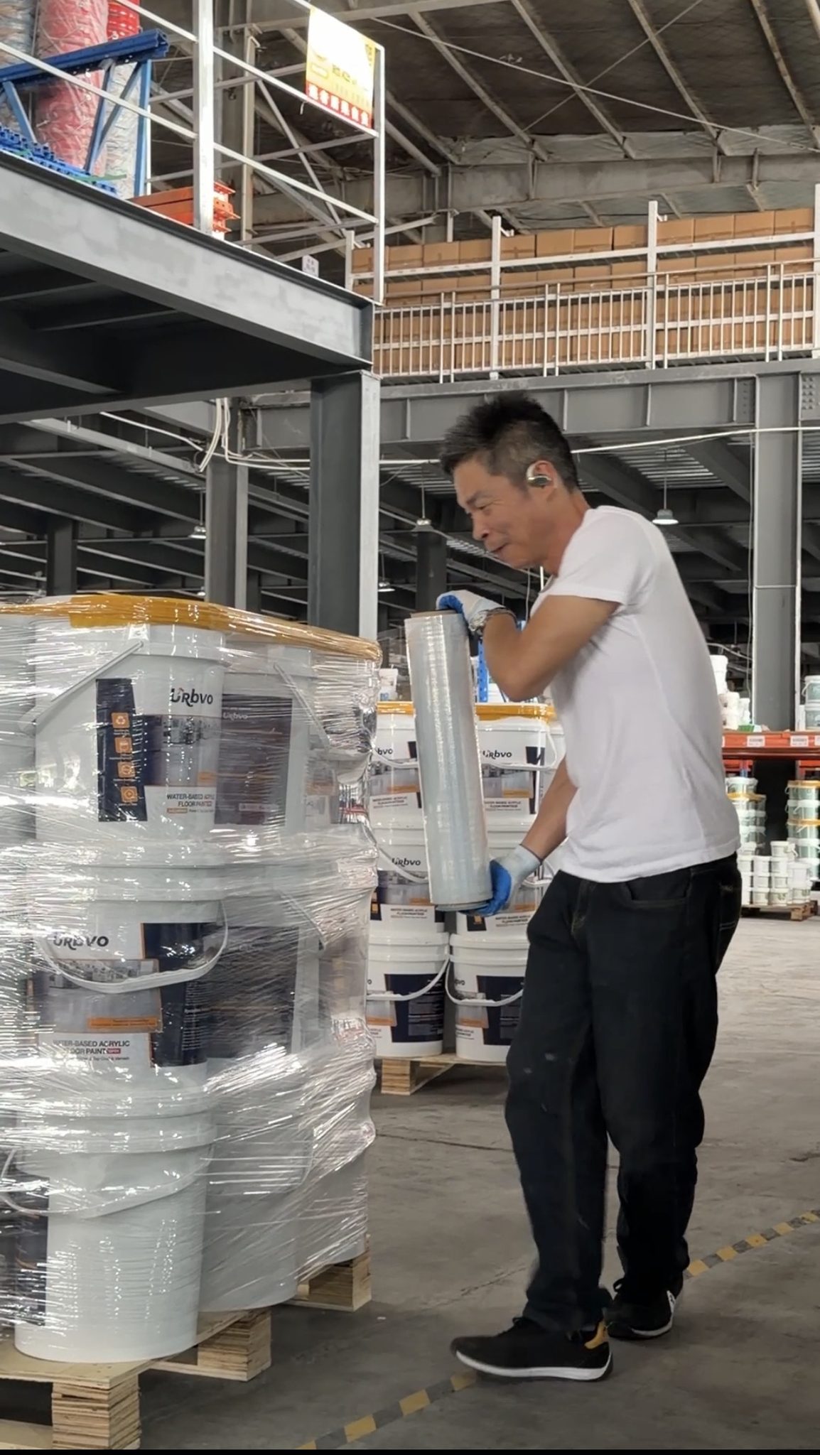 URBVO coating buckets being stretch wrapped on pallets