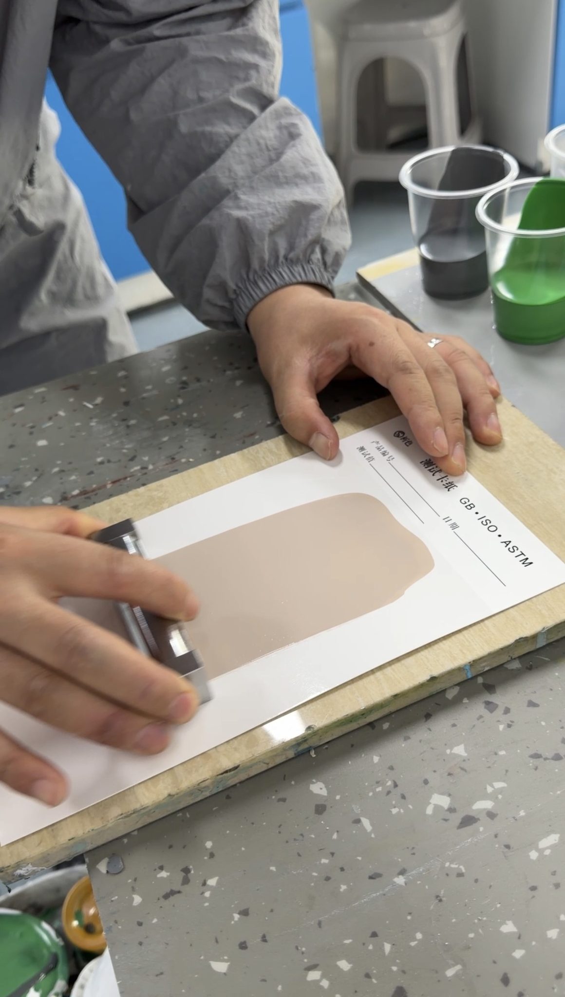 Coating sample being applied to a test card in the URBVO laboratory
