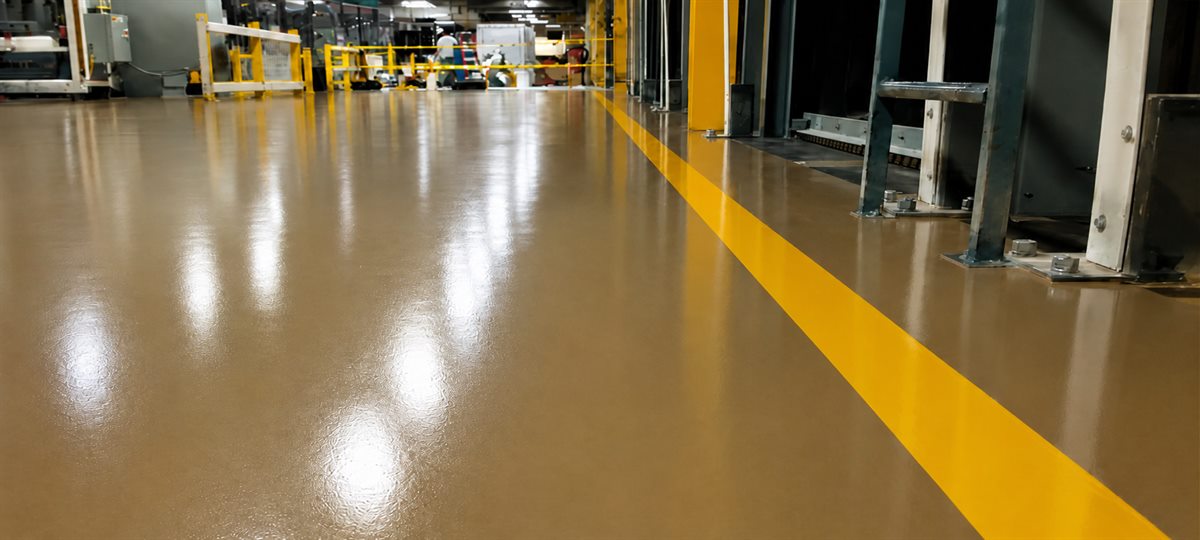 Glossy polyurethane factory floor with a yellow safety line